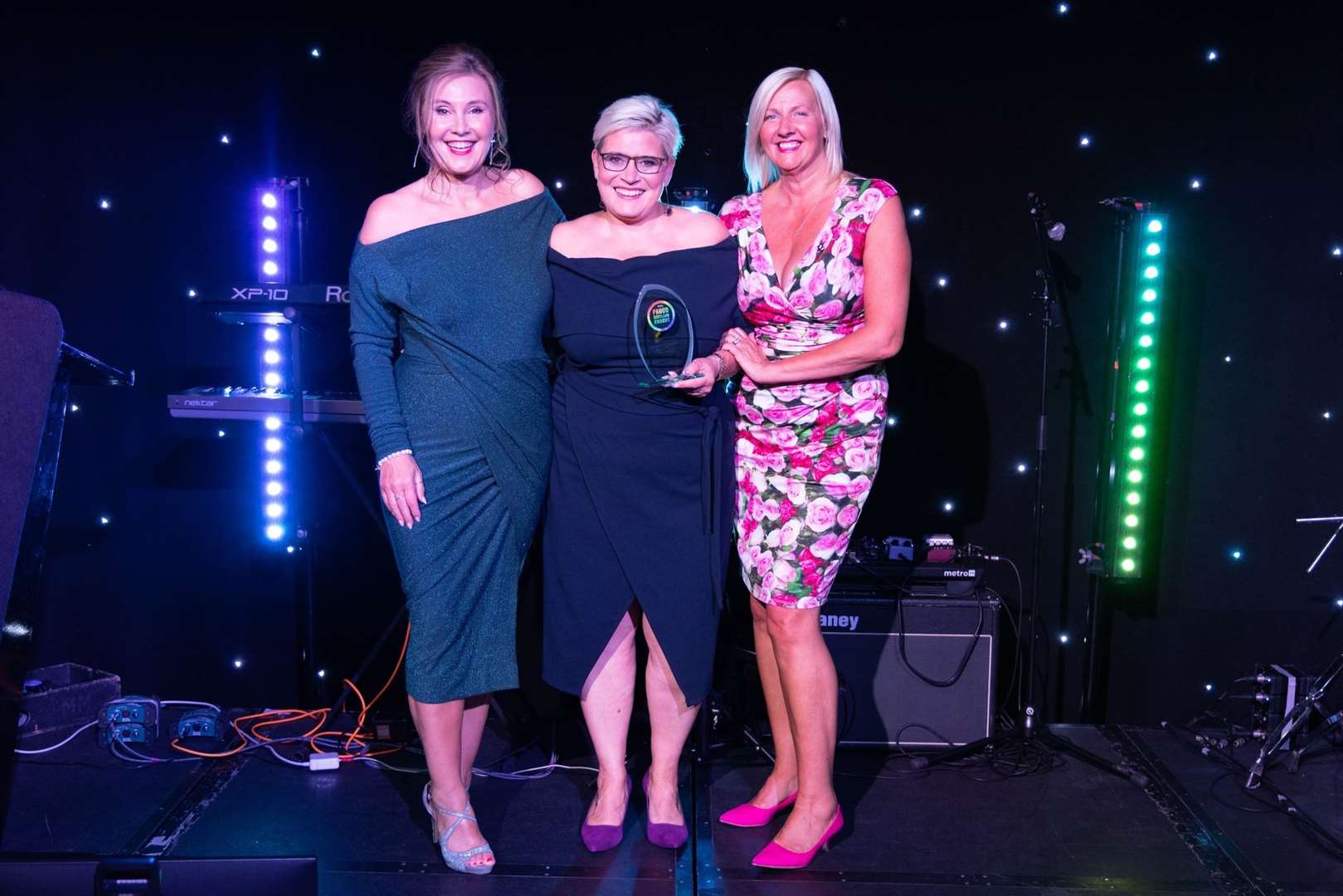 Fiona Shearer (centre) won the 2023 Proud Scotland Award for education on a night hosted by Still Game star Jane McCarry. Picture: Proud Scotland Awards