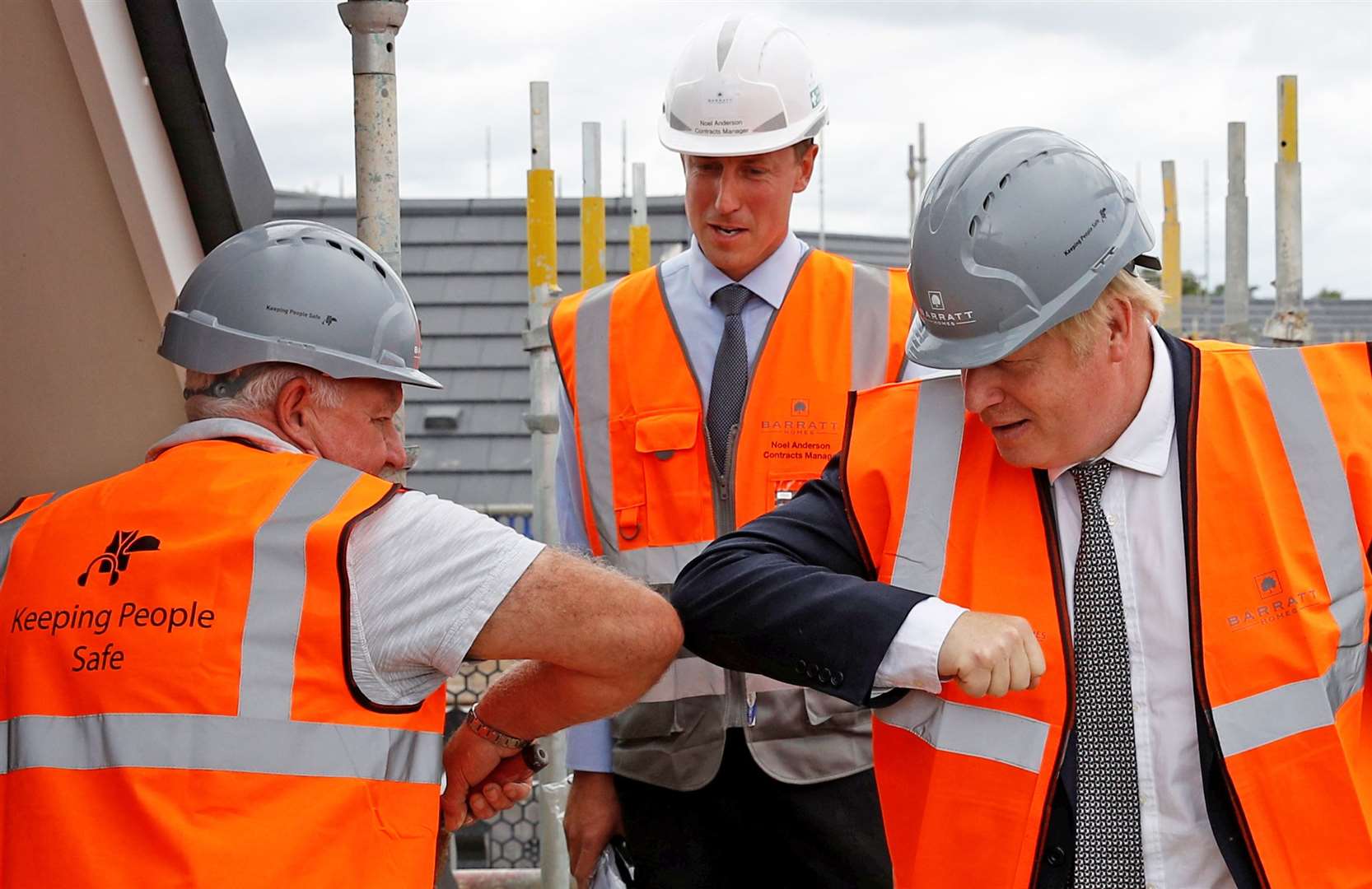 Elbow bump greetings, like the one between Boris Johnson and a construction worker in Cheshire, may continue if people want to avoid shaking hands (Phil Noble/PA)