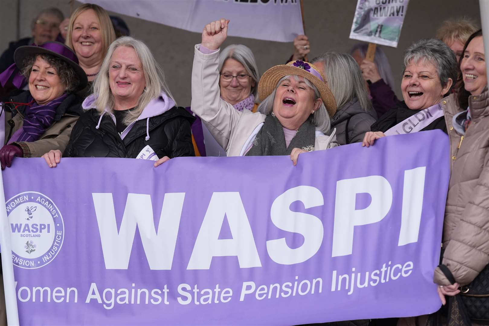 People at a Women Against State Pension Inequality (Waspi) protest outside the Scottish Parliament in Edinburgh, campaigning for justice and full compensation (Andrew Milligan/PA)