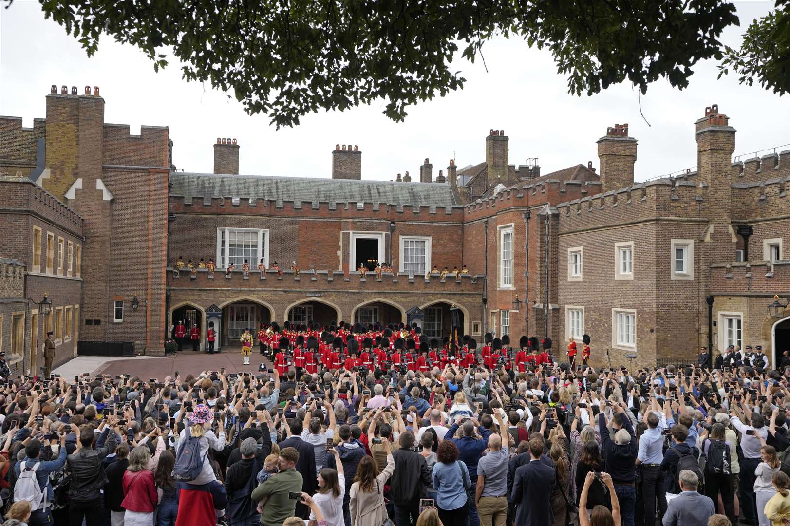 Around 1,000 members of the public were invited into the palace grounds to watch (Kirsty Wigglesworth/PA)