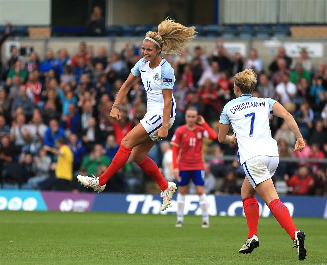 Daly jumps in the air as she celebrates scoring England’s third goal of the game during a 2017 Uefa Women’s European Championship qualifying match (PA)
