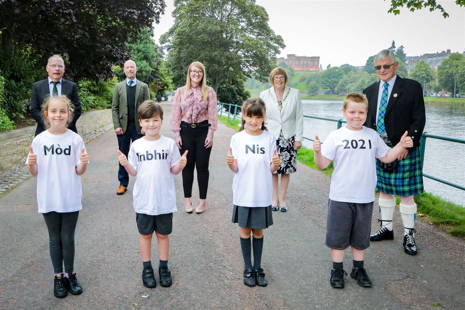 Mòd 2021 launches ahead of this year's festival in Inverness Picture shows Children from Inverness Gaelic School in front row L_R, Ava Williams -age 9 (Mòd) ,Ruaraidh MacLeod - age 6 (Inbhir), Isobel Simpson - age 8 (Nis) ,Hunter Williams - age 8 (2021), back row L-R, Norrie Mackay - Vice Convener of the Local Organising Committee, Councillor Calum Munro (Chair of the Gaelic Committee) ,Mairi Macdonald - Local Organising Committee , Depute Provost Councillor McAllister, Allan Campbell - President of An Comunn Gaidhealach celebrating the launch of Mòd 2021 on the banks of the River Ness 2 September 2021