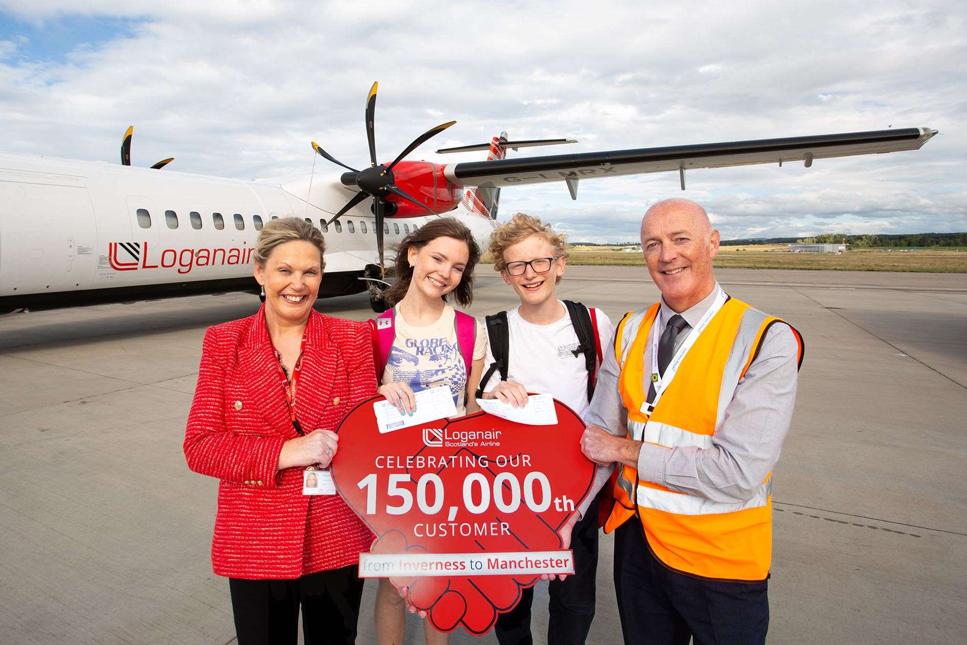 Loganair's head of sales Donna McHugh, twins Archie and Florrie Gray, and Dan Mason, Inverness Airport operation manager.