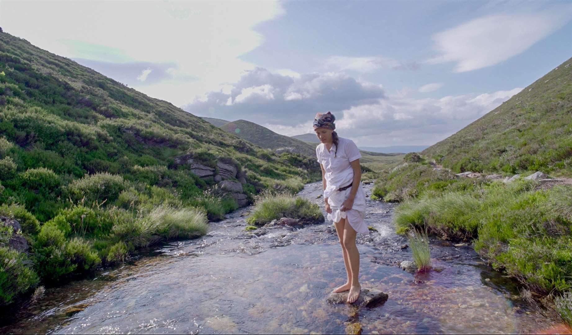 Elise dips her toes at the Pools of Dee. Picture: PA Photo/Woman With Altitude