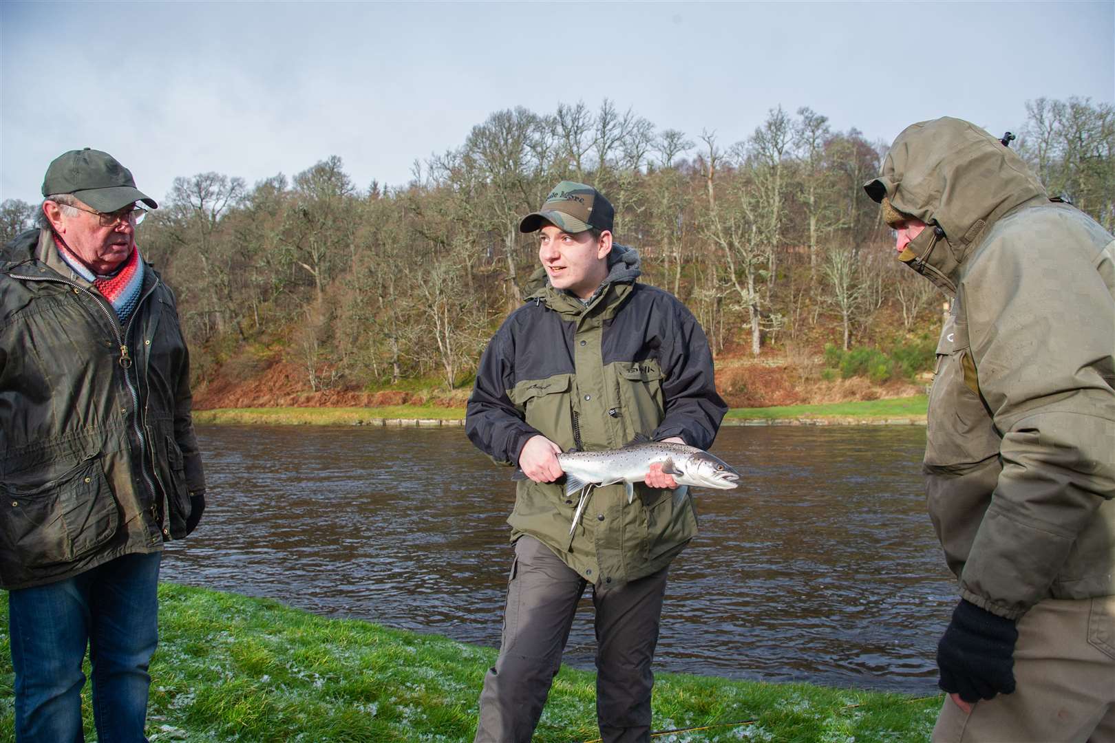 Scott Mellis with his sea trout at the 2020 opening of the salmon fishing season on the River Spey. Picture: Daniel Forsyth/HNM