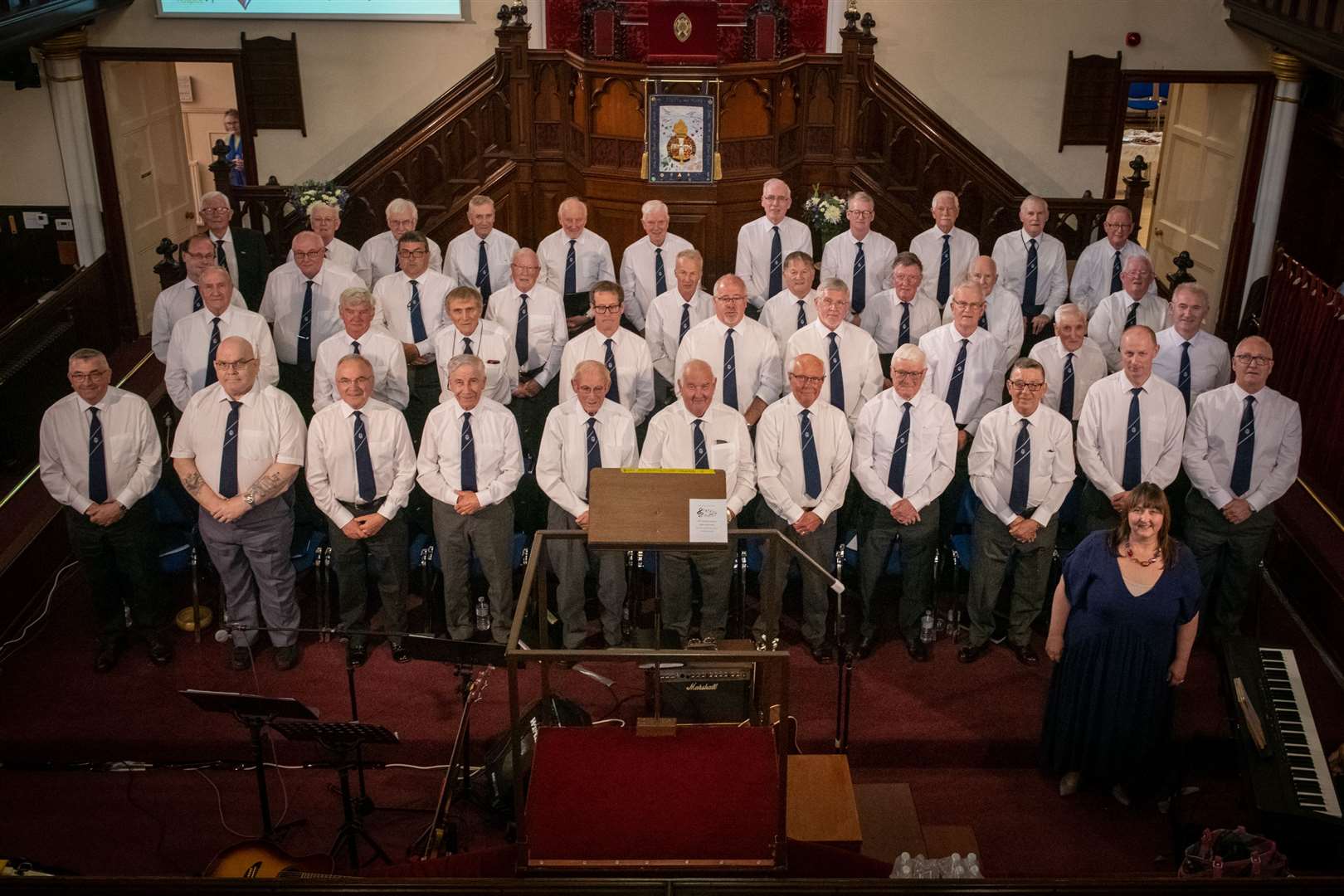 Conductor Eileen Mackintosh (bottom right) and The Choir.