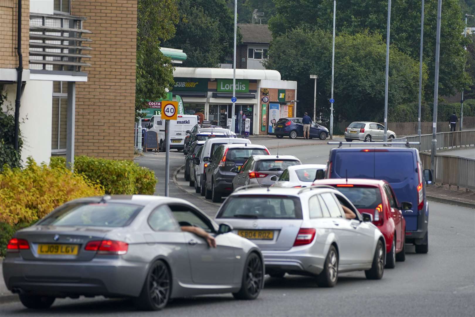 Cars queue for fuel at a BP petrol station in Bracknell, Berkshire (PA)