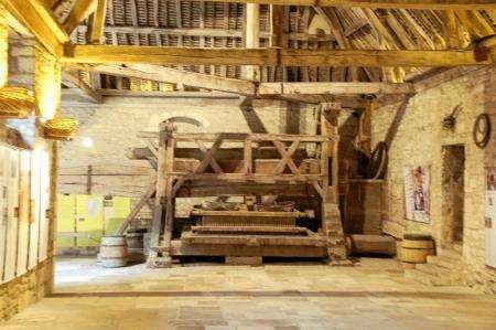 The ancient wooden grape press at Clos Du Vougeot