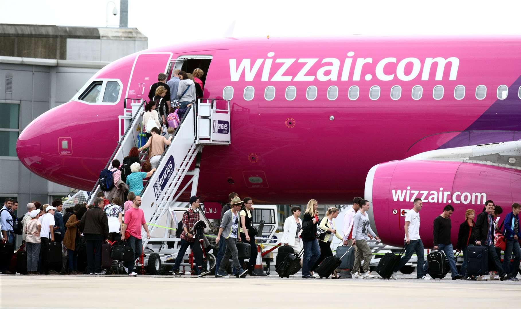 Passengers getting on a Wizz Air plane at Luton (Steve Parsons/PA)