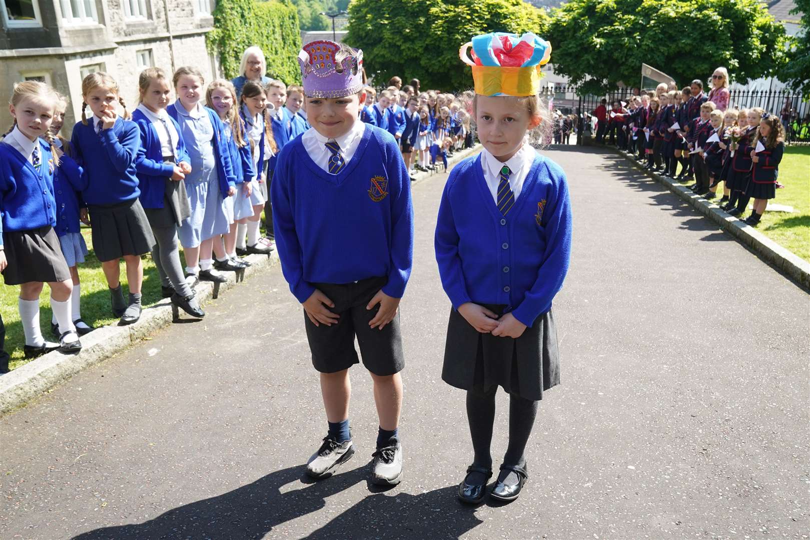 Charles Murray and Camilla Nowawakowska sported paper crowns for the royal visit (Brian Lawless/PA)