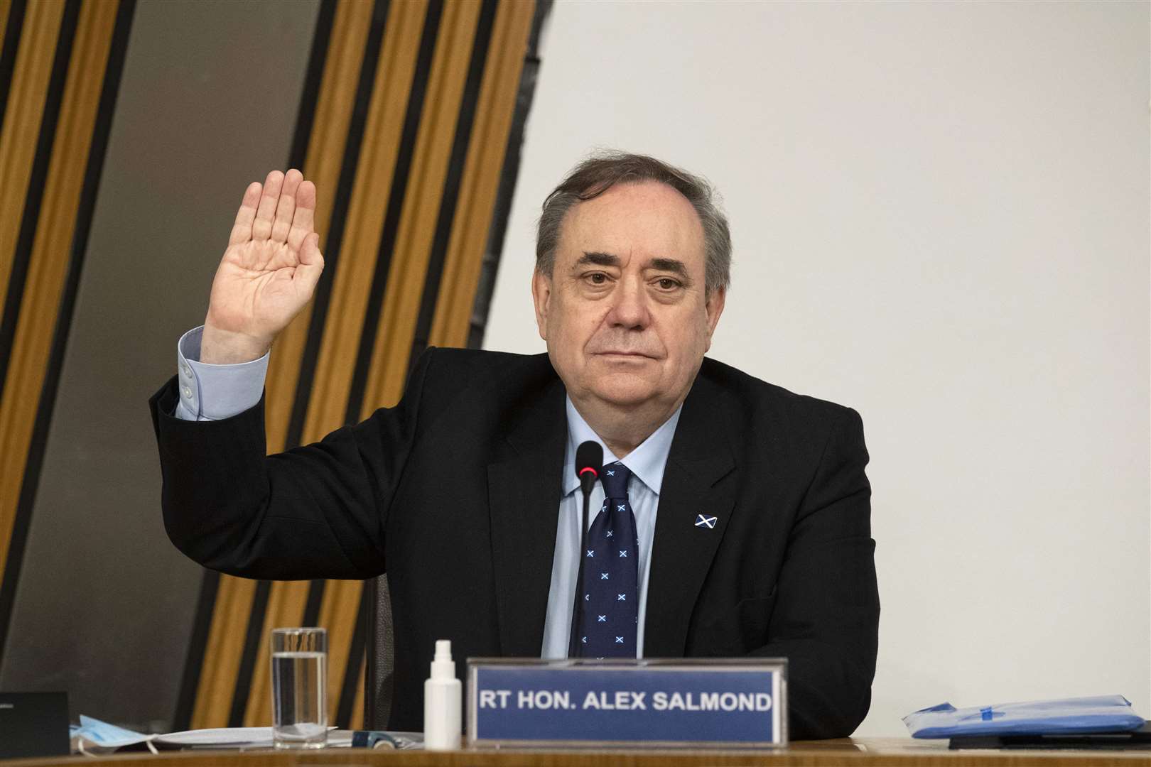 Former first minister Alex Salmond is sworn in before giving evidence to the committee (Andy Buchanan/PA)