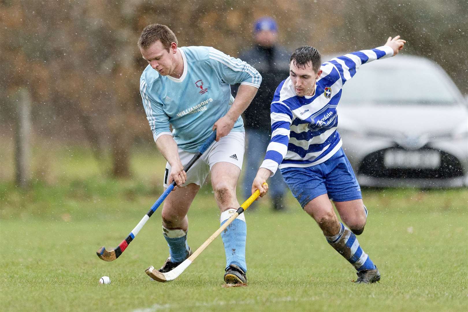 Ali MacLennan (Cabers) with Michael Russell (N’more). Caberfeidh v Newtonmore in the MOWI Premiership, played at Castle Lead, Strathpeffer.