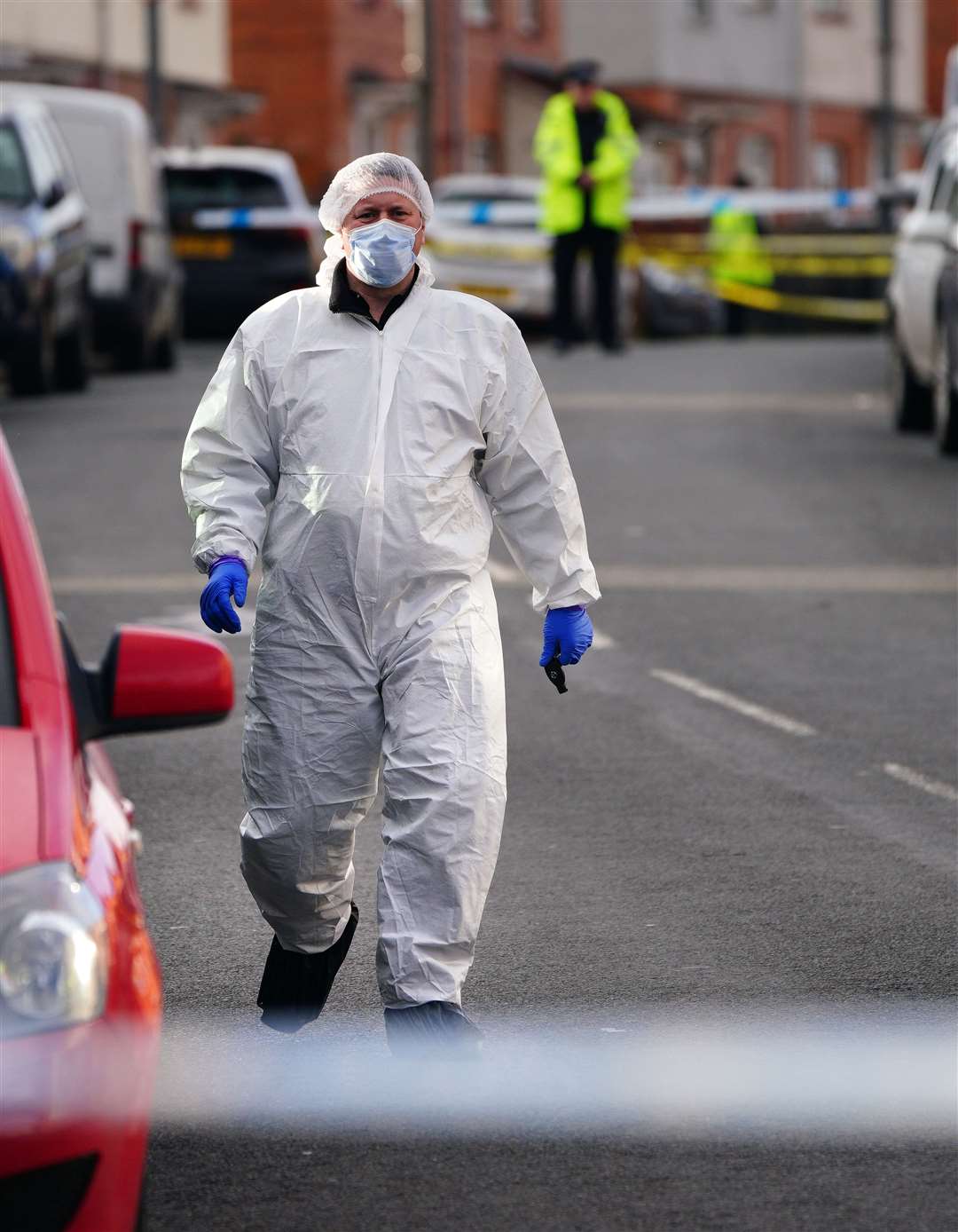 Police and forensic investigators at the scene (Ben Birchall/PA)
