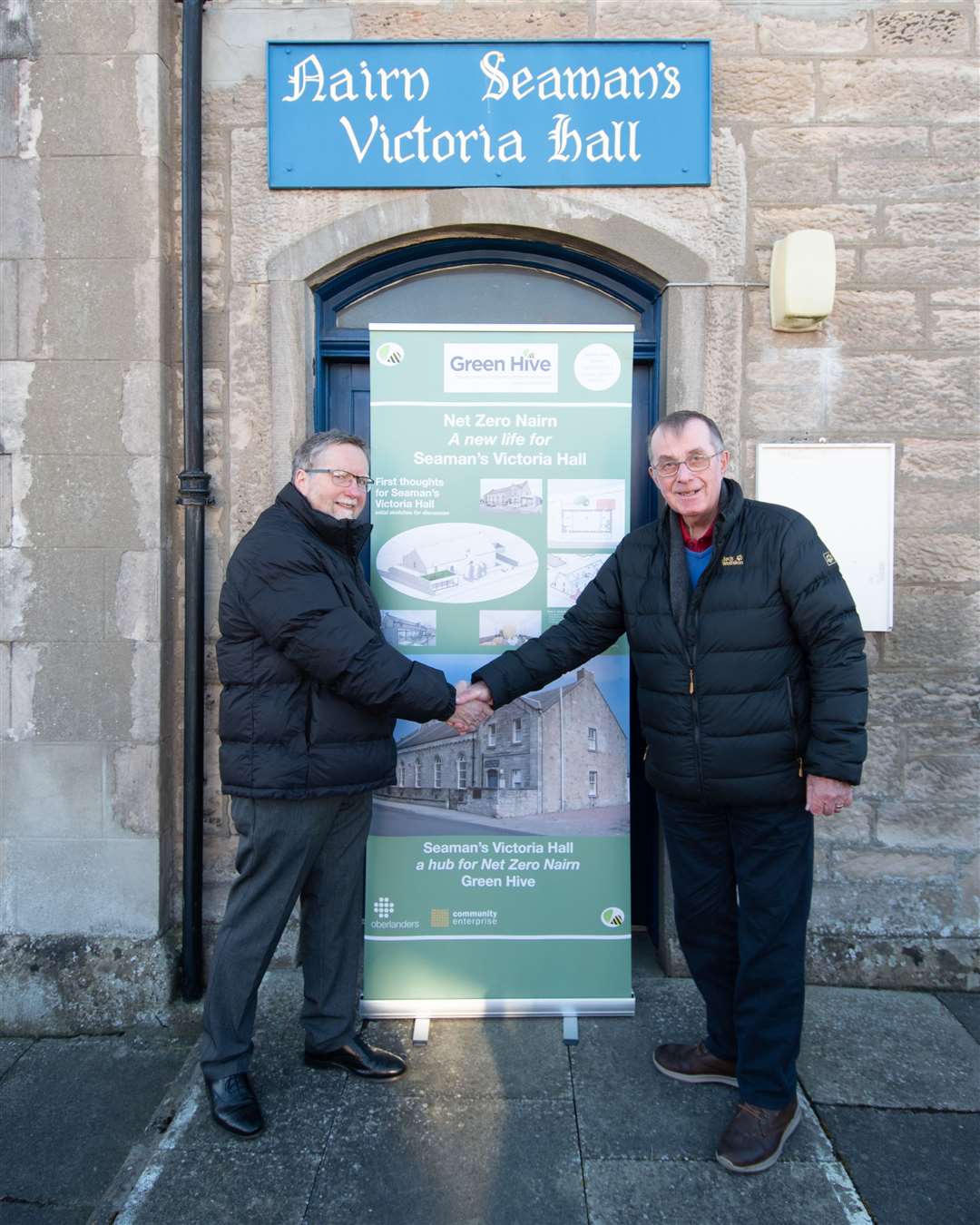 Ninian Coggs, right, chairman of Seaman’s Hall Trustees, at the handover of the hall to Simon Noble of Nairn Green Hive.