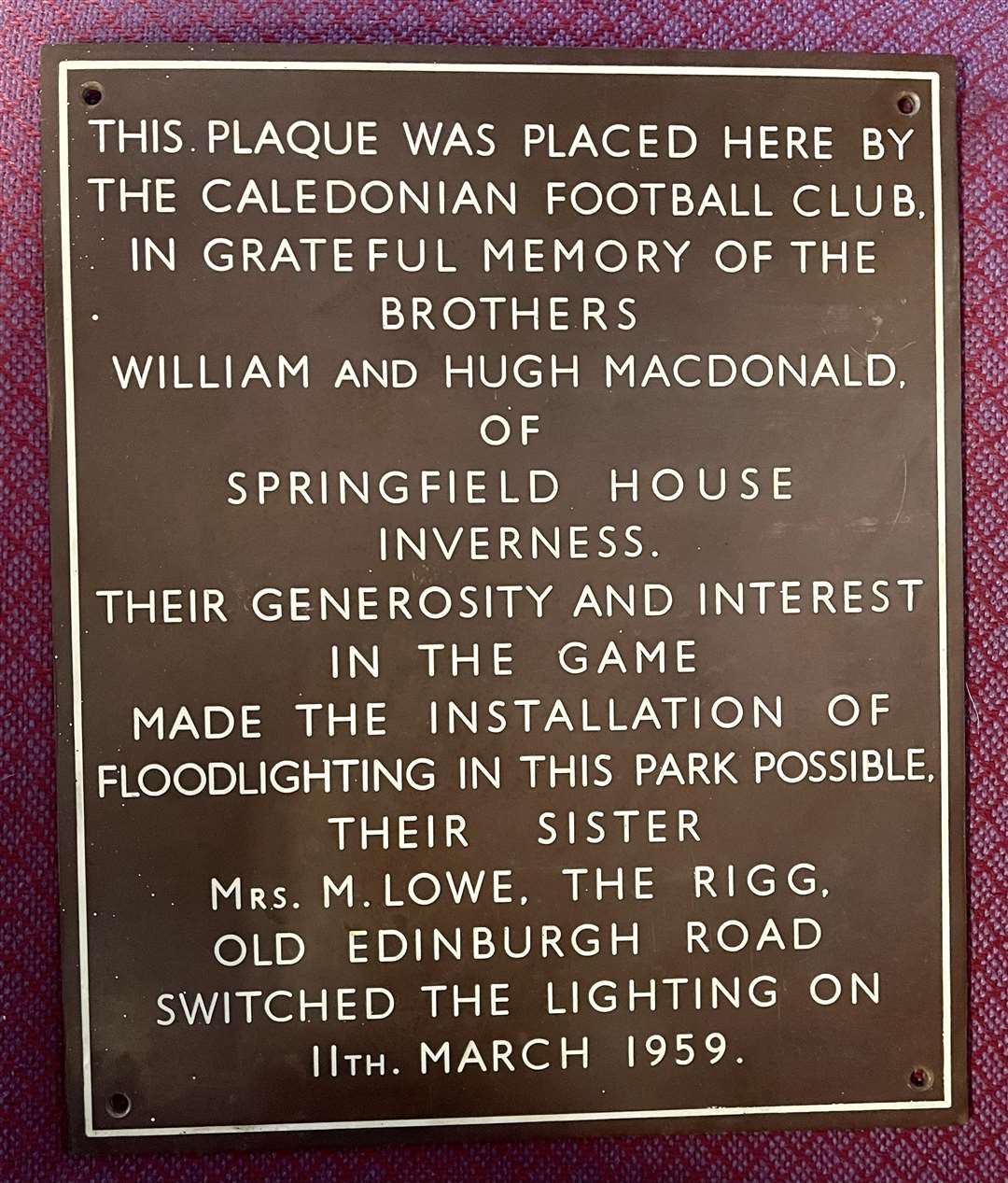 A plaque marked the installation of floodlighting at Caledonian Football Club ground in 1959.