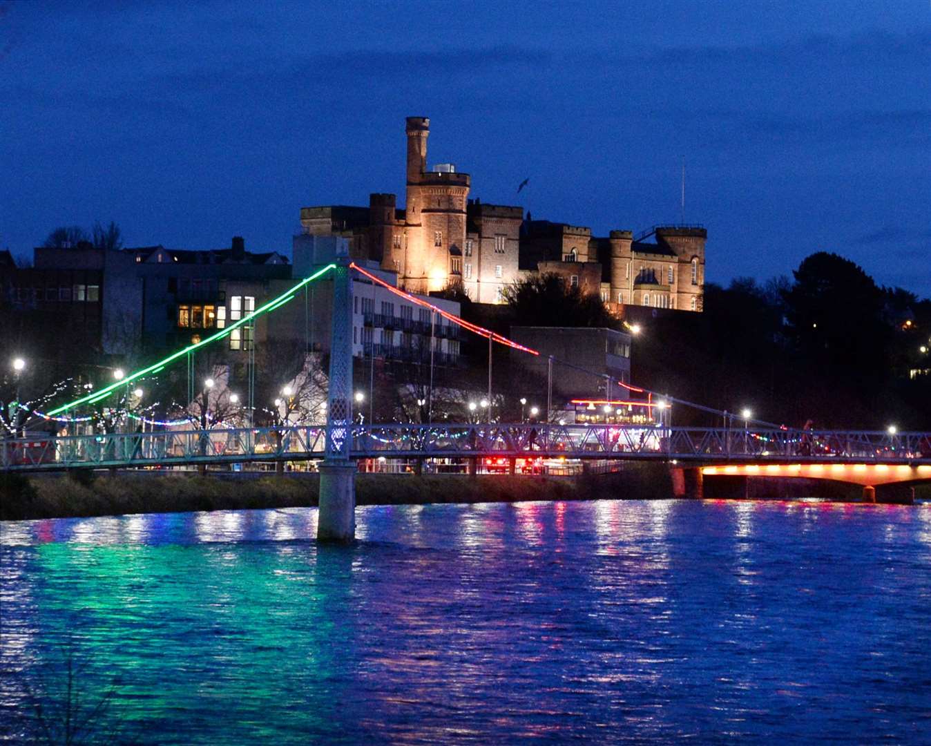 The River Ness and Inverness Castle at night.