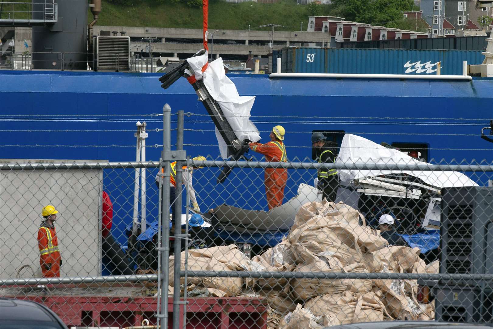 Debris is unloaded from the ship Horizon Arctic (Paul Daly/The Canadian Press/AP)