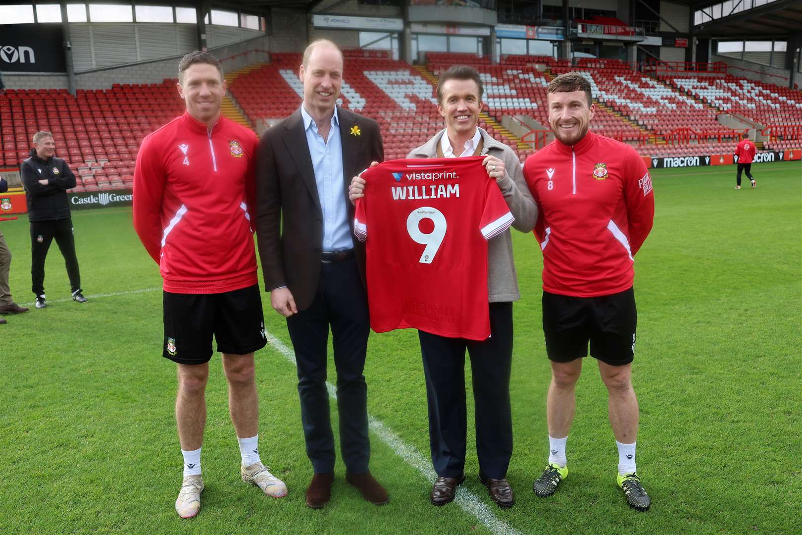 William with his personalised Wrexham AFC shirt, meeting club chairman Ben Tozer, Rob McElhenney and captain Luke Young (Chris Jackson/PA)
