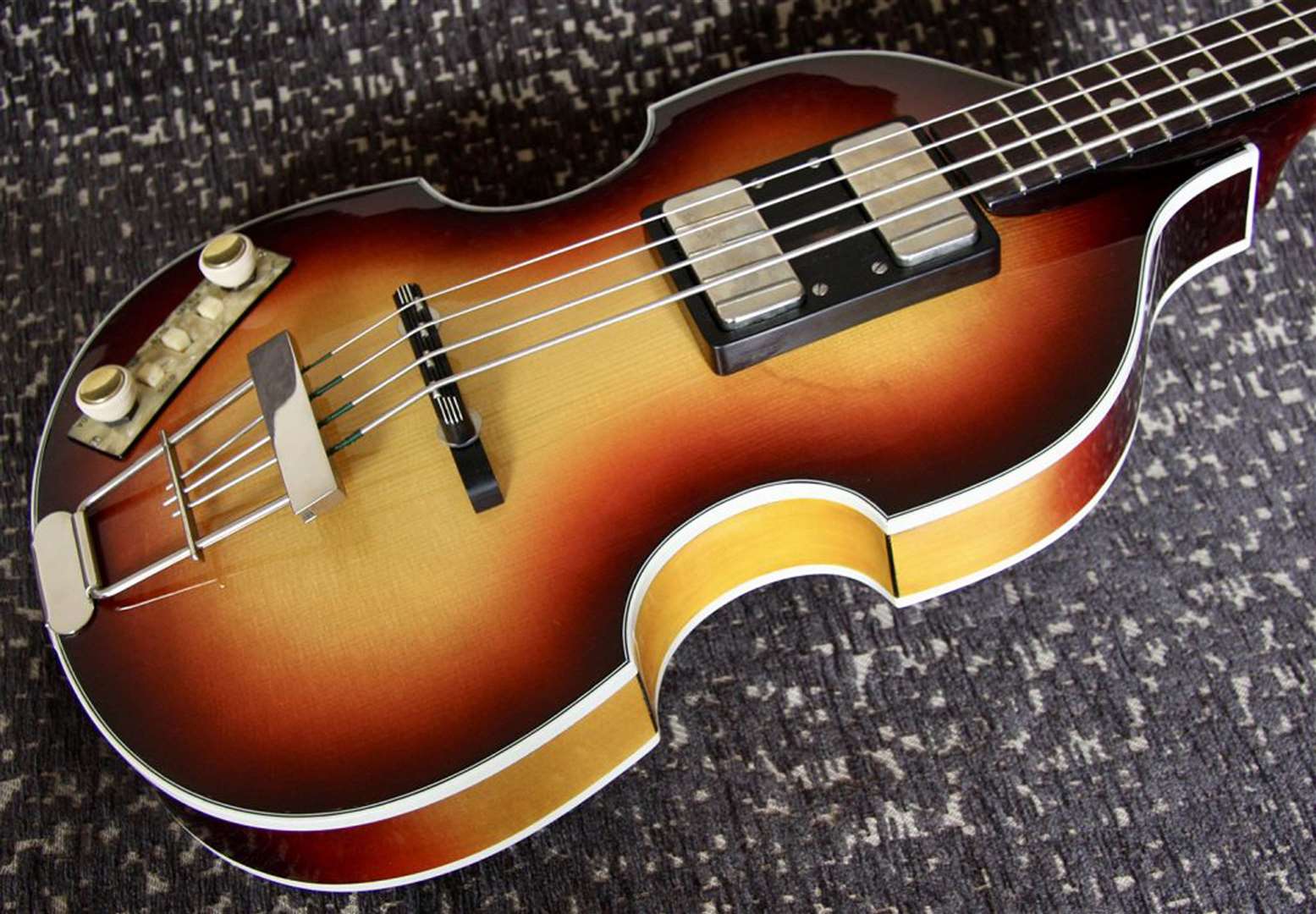 Detail of a replica of Sir Paul McCartney’s original Hofner bass guitar (Guncotton Guitars/PA)