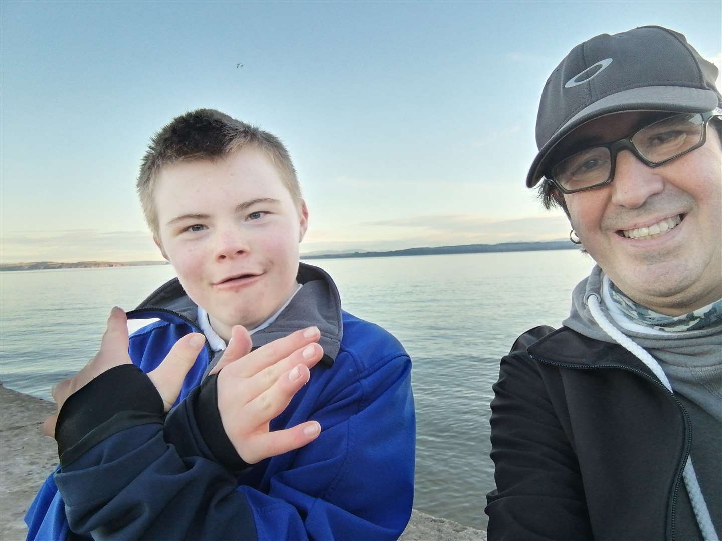 Finlay McKenzie on a day at the seaside with support worker Jon Lane