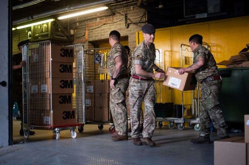 HELPING HANDS: Members of the 101 Logistic Brigade of the British Army deliver a consignment of medical masks to St Thomas’ hospital in London.