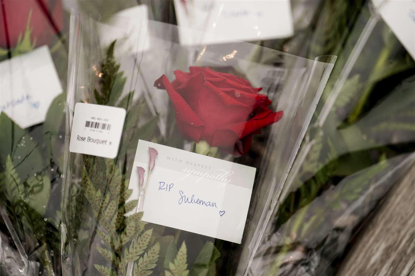 Flowers left in St John’s harbour on Friday (Jordan Pettitt/PA)