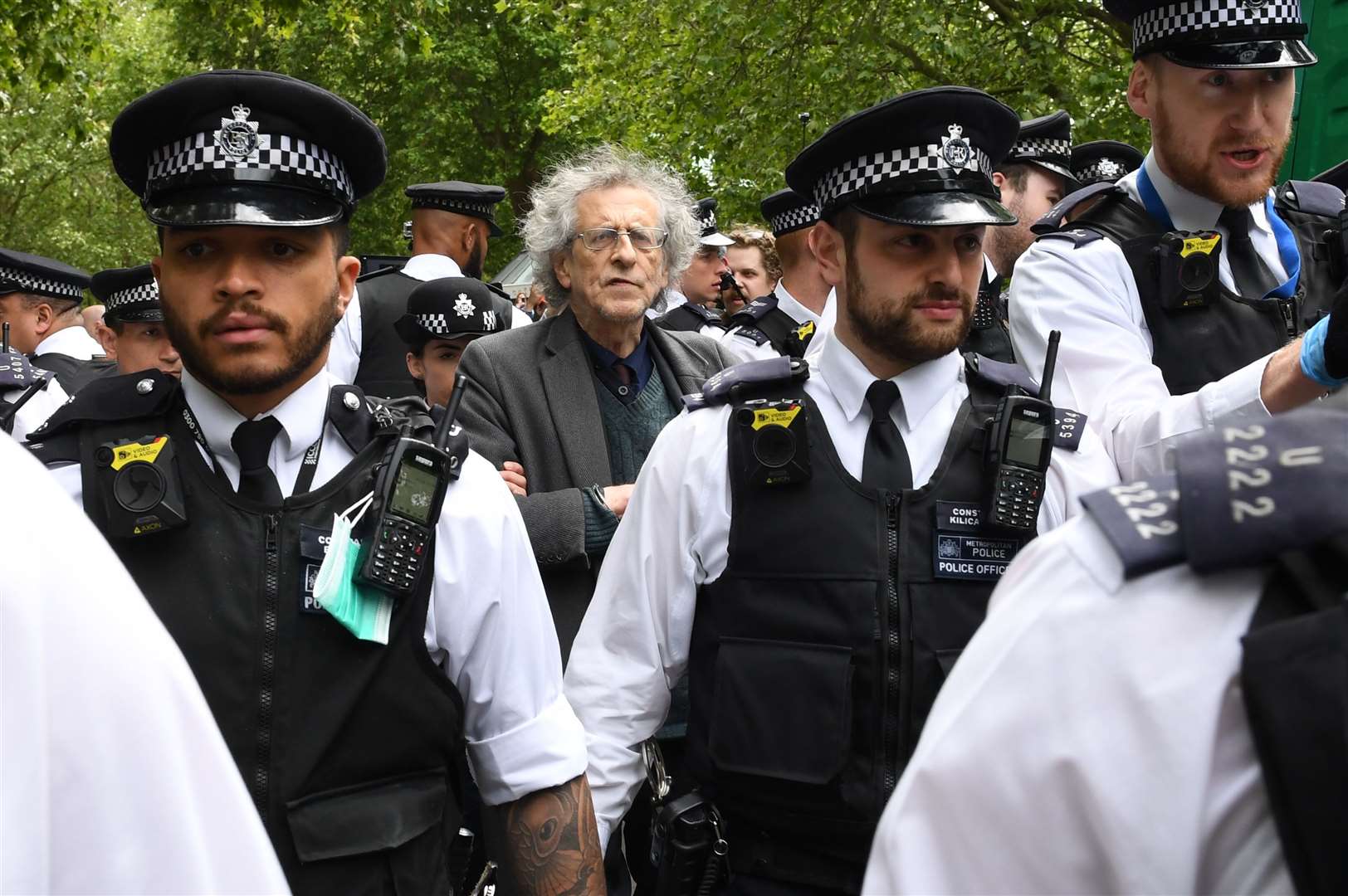 Police lead away Piers Corbyn during a protest in Hyde Park, London, in May (Stefan Rousseau/PA)