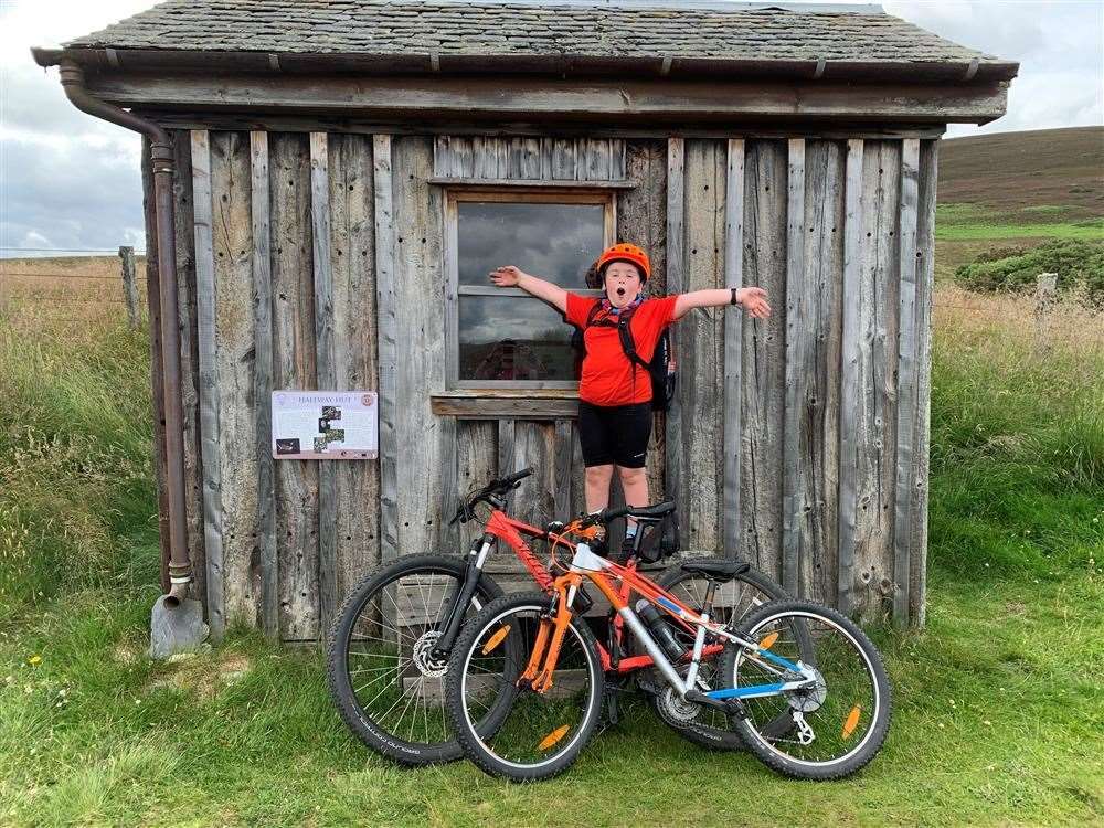Nine-year-old fundraiser Andrew Ochojna, who has autism, cycled the Dava way to raise money for the new Pines website.