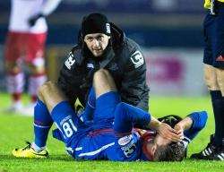 Fisher lies in agony after injuring his ankle in the Scottish Cup replay against Stirling Albion in January.
