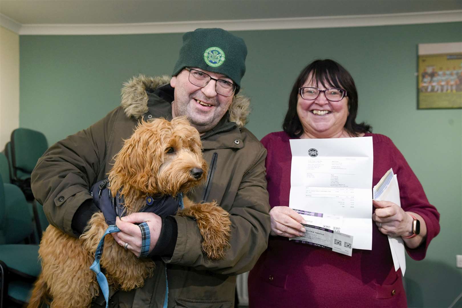 Andrew and Amanda Murray with Hector and their Celtic v Buckie Thistle cup tie tickets...Picture: Beth Taylor.
