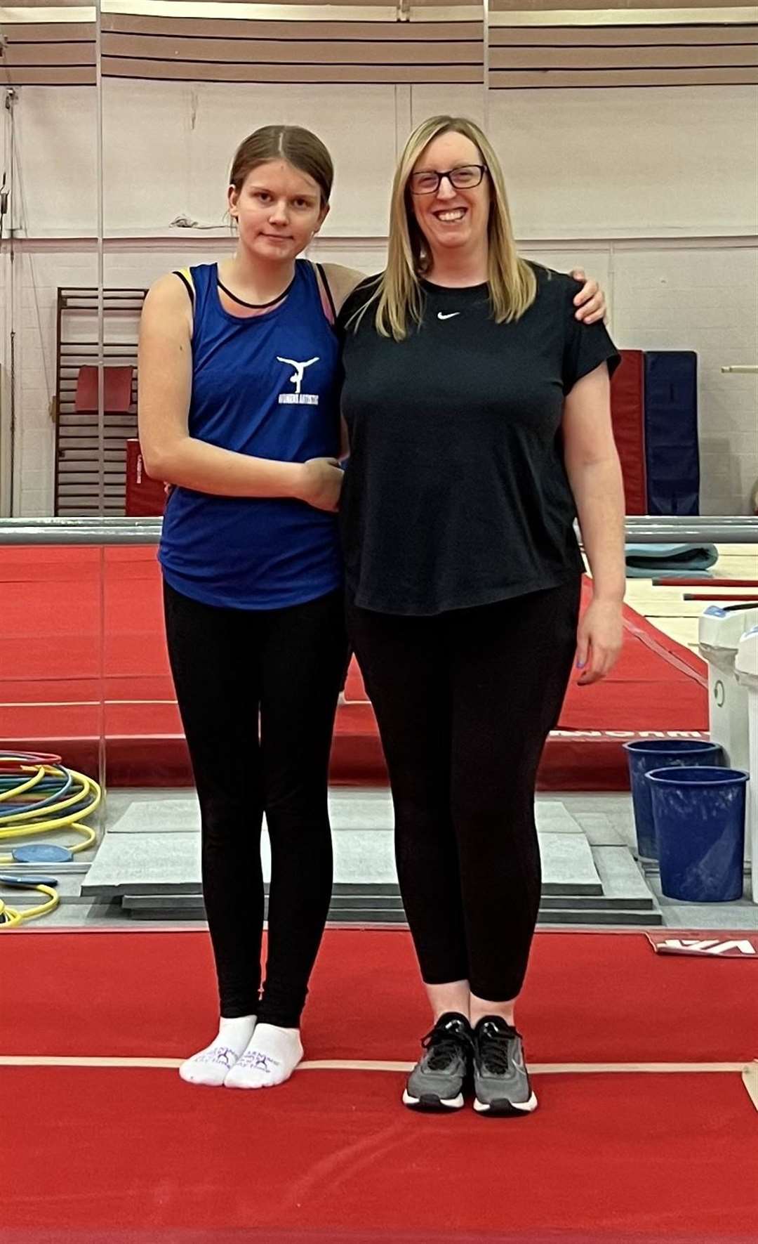 Carol with coach Angela Turner at a City of Glasgow Gymnastics Club summer camp.