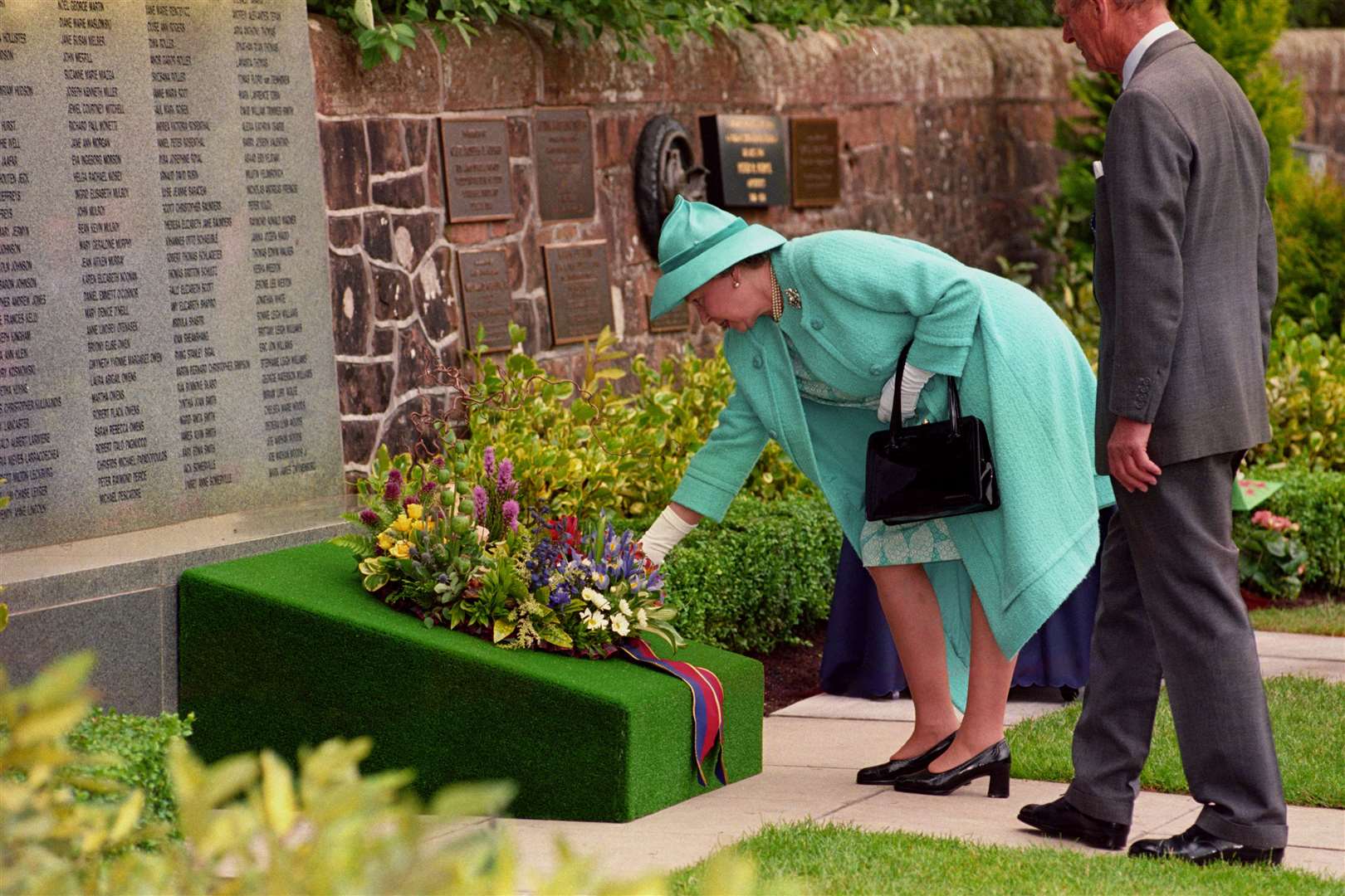 The late queen also laid a wreath at the memorial (Chris Bacon/PA)
