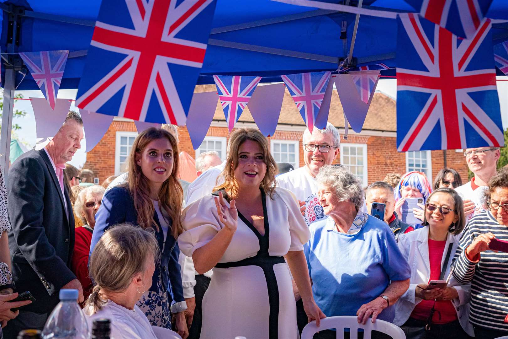 Princess Beatrice (left) and Princess Eugenie (centre) at the Coronation Big Lunch in Chalfont St Giles, Buckinghamshire on May 7 (Ben Birchall/PA)