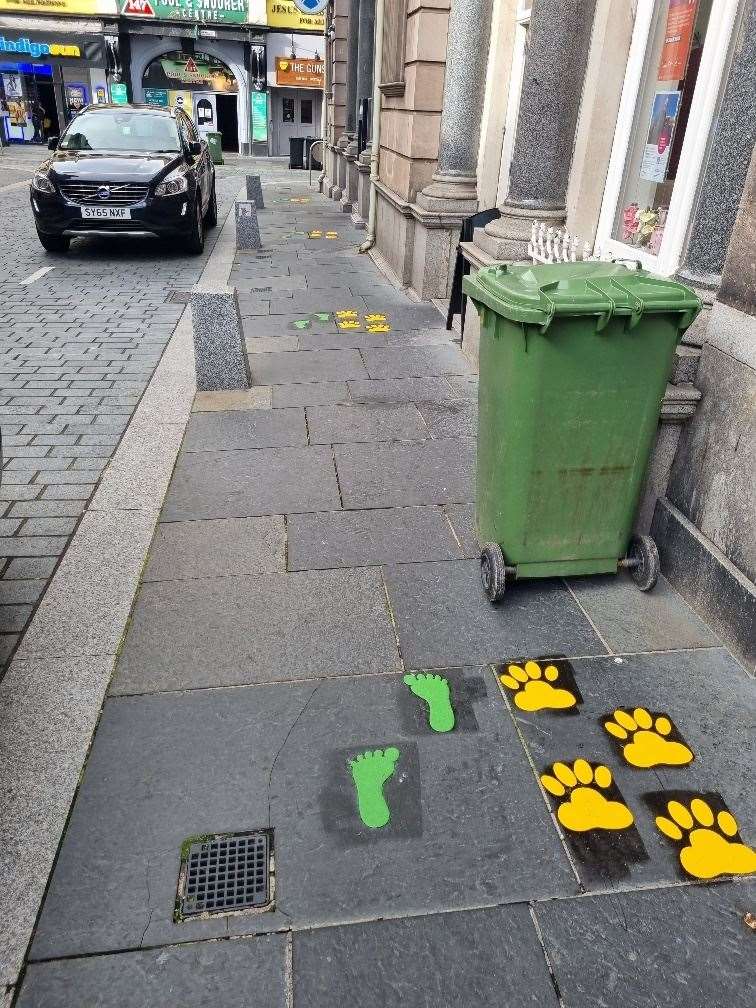 Colourful footprints have appeared in the city centre.