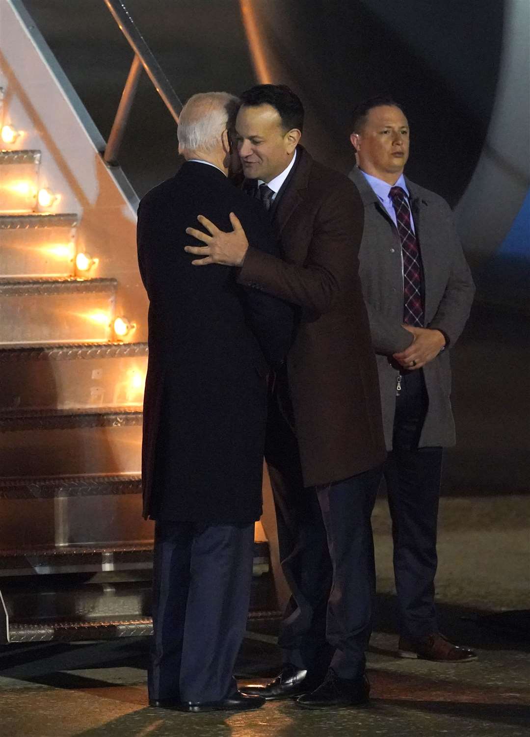 US President Joe Biden hugs Taoiseach Leo Varadkar as he boards a plane to leave Ireland West Airport Knock (Niall Carson/PA)