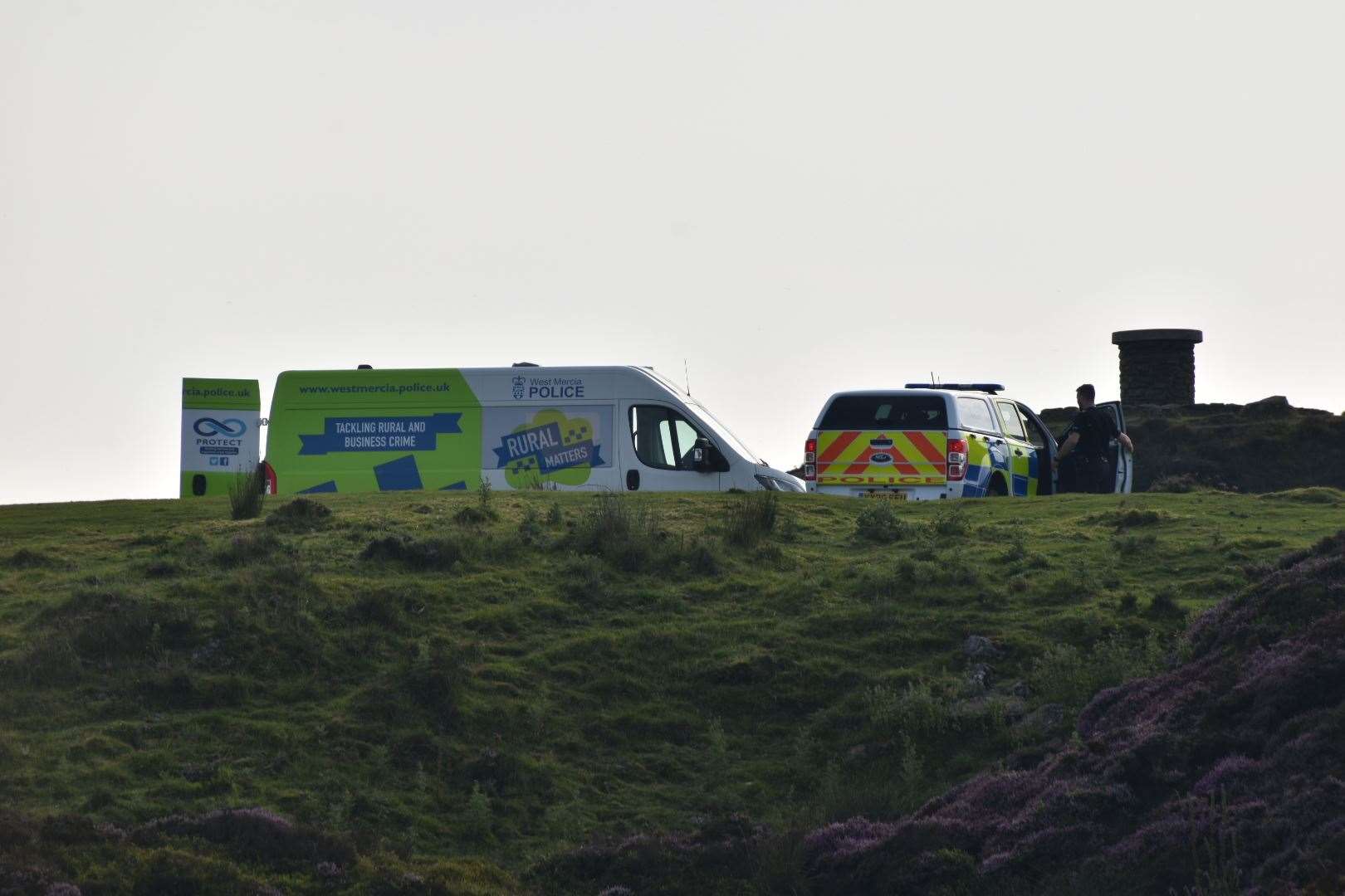 Police officers near the summit of Brown Clee Hill following the murder (Matthew Cooper/PA)