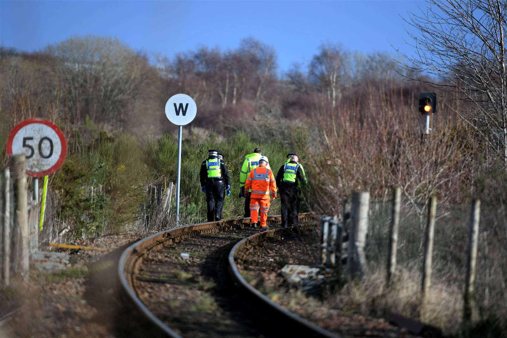 Police investigating the man's death were pictured walking along the tracks near Clachnaharry on Wednesday.