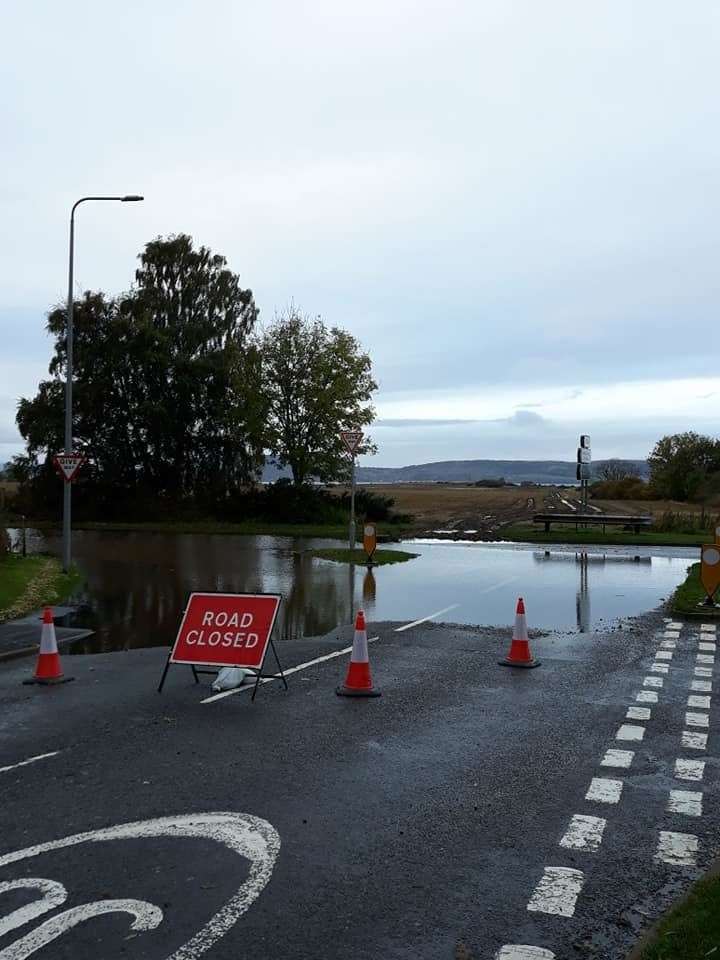Flooding at the junction between Culloden Road and Barn Church Road.