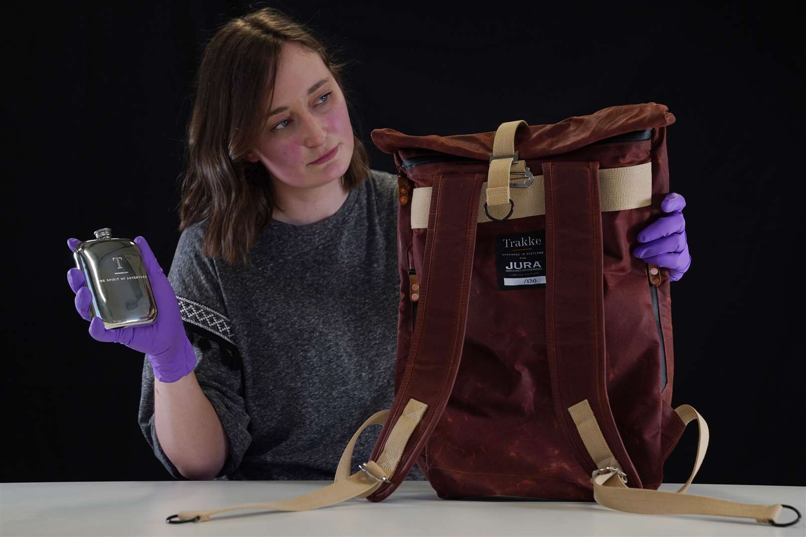 Laura Scobie with a backpack issued by the Isle of Jura Distillery and accessories brand Trakke (National Museums Scotland/PA)