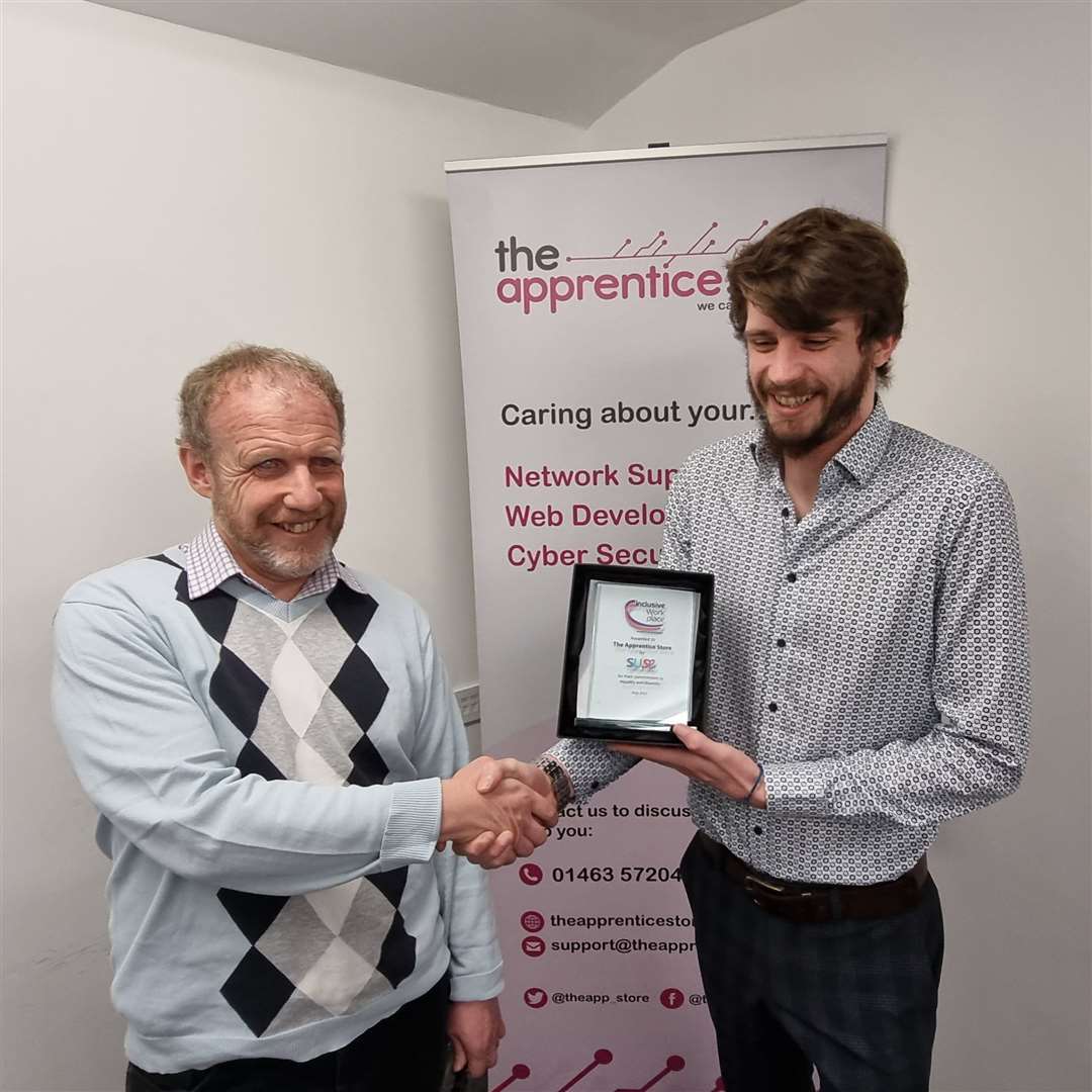 Neil Skene from SUSE presening award to Declan Ramsey from The Apprentice Store.