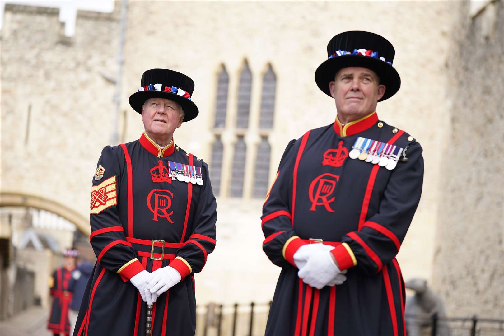 Beefeaters model their new uniform with Charles’s cipher for the coronation at the Tower of London (Yui Mok/PA)