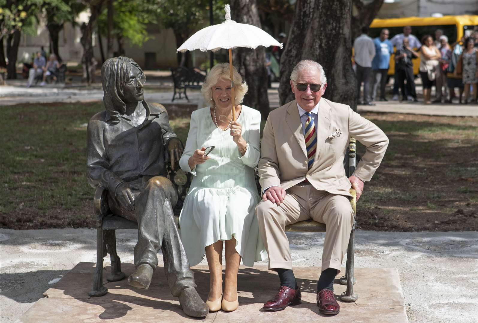Charles and the then-Duchess of Cornwall sitting on the John Lennon memorial bench in Havana, Cuba (Jane Barlow/PA)