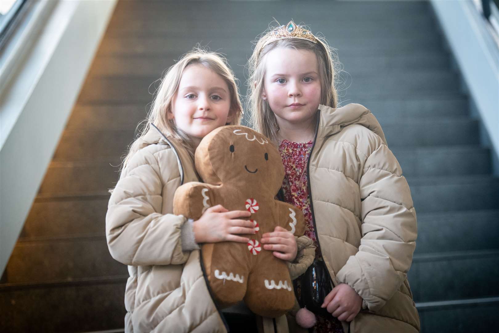 Beatrix and Freya Peach with a giant gingerbread man . Picture: Callum Mackay..