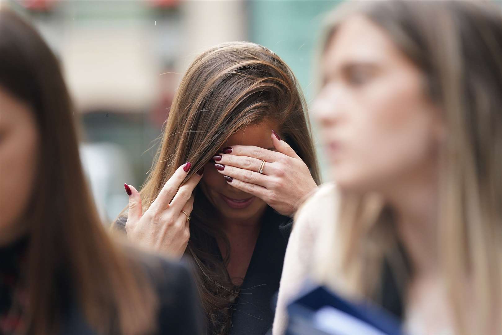 Actress Nikki Sanderson leaving an earlier hearing at the Rolls Building in central London (PA/Yui Mok)