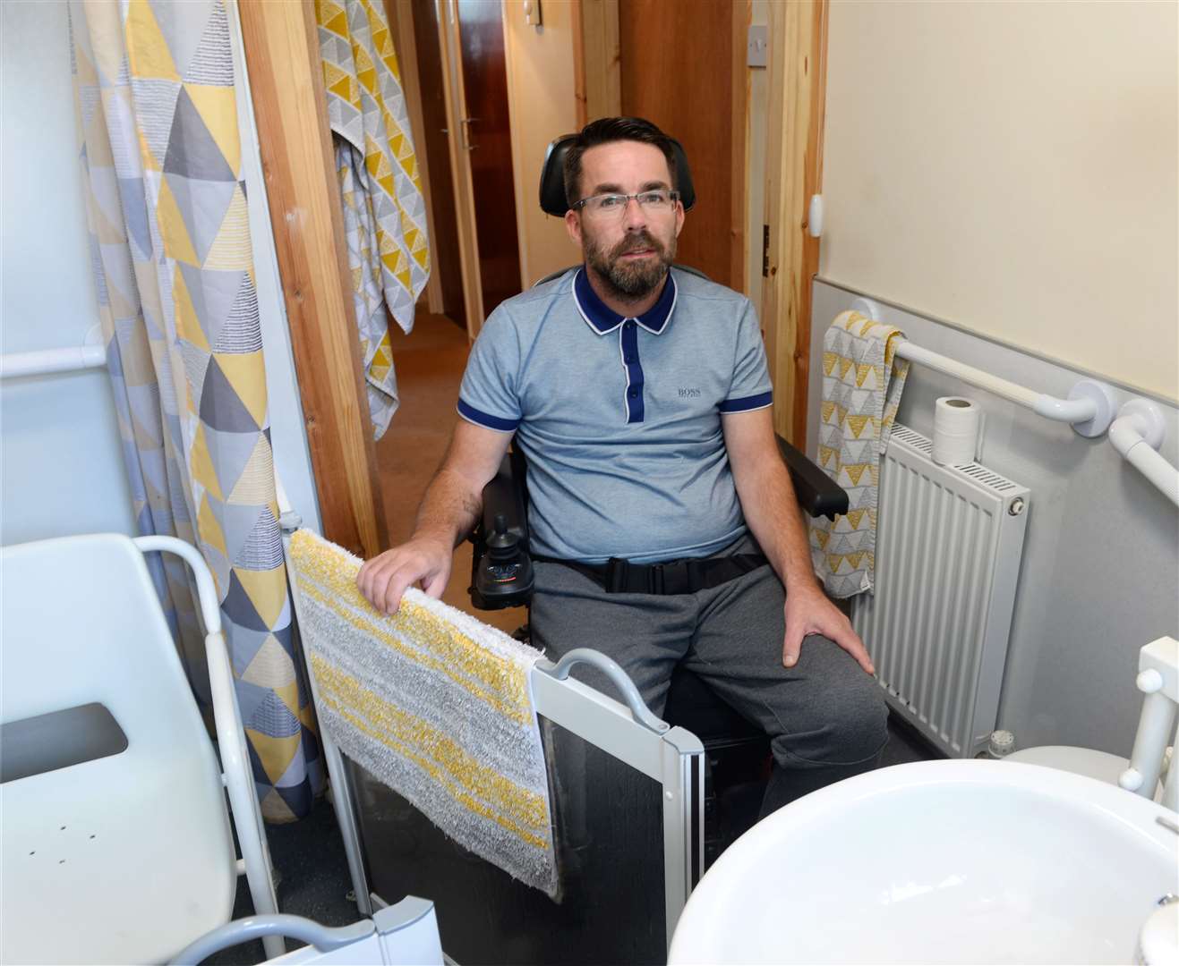 MS sufferer Barry MacDowall struggles with access to walk in shower due to space..Picture: Gary Anthony..