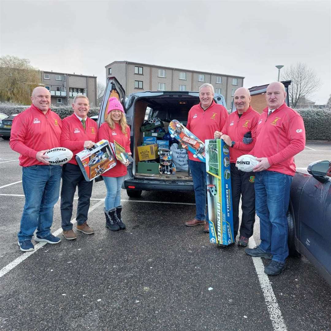 (Left to right) Andrew Russell, club president Roy Dinnes, Gillian Russell, Gavin McDonald, Rob Gill and Graham Findlater with some of Highland Rugby Club's gifts and toys for MFR Cash for Kids