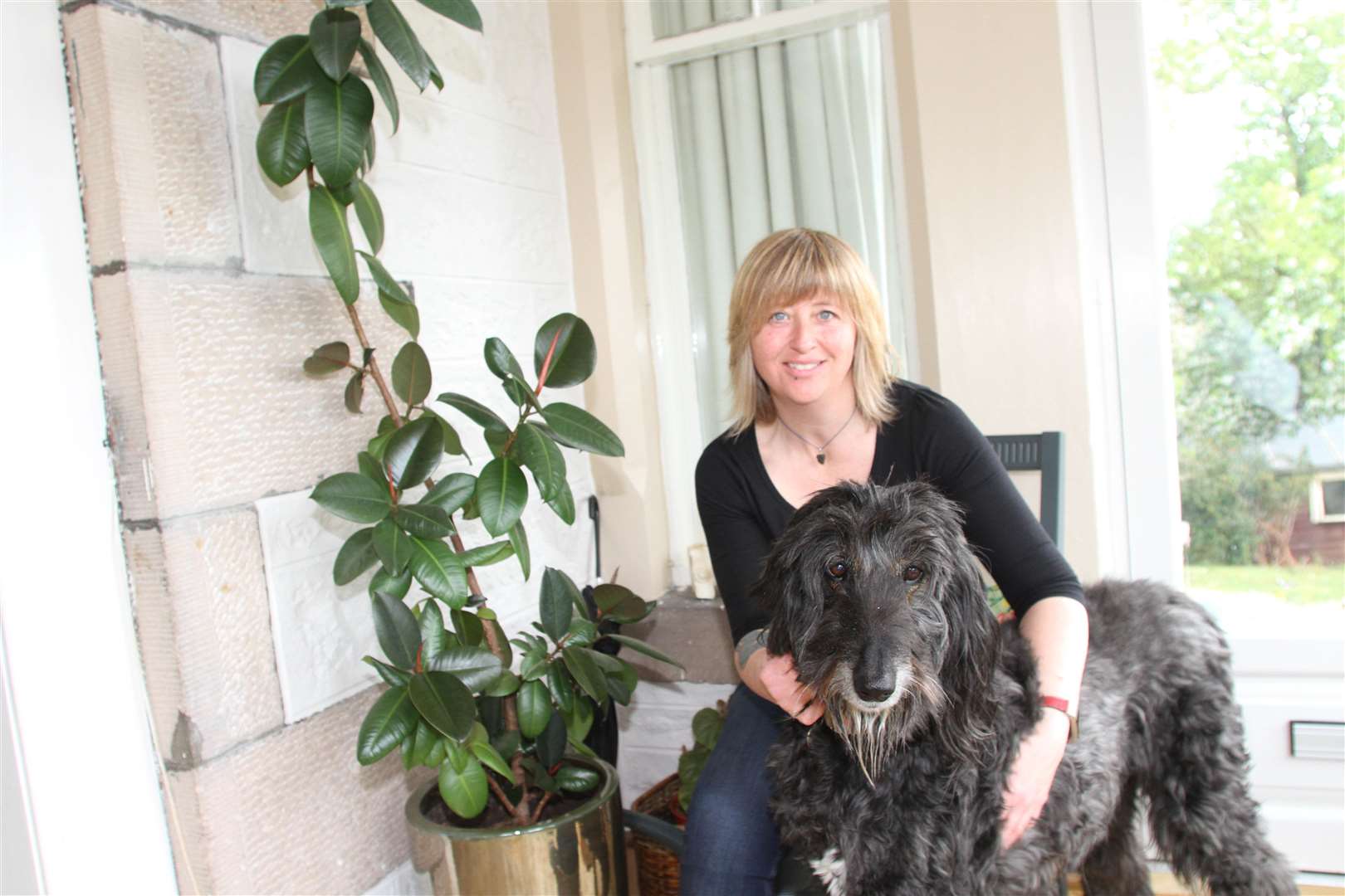 Coucnillor Pippa Hadley and her dog called Scrumptious.