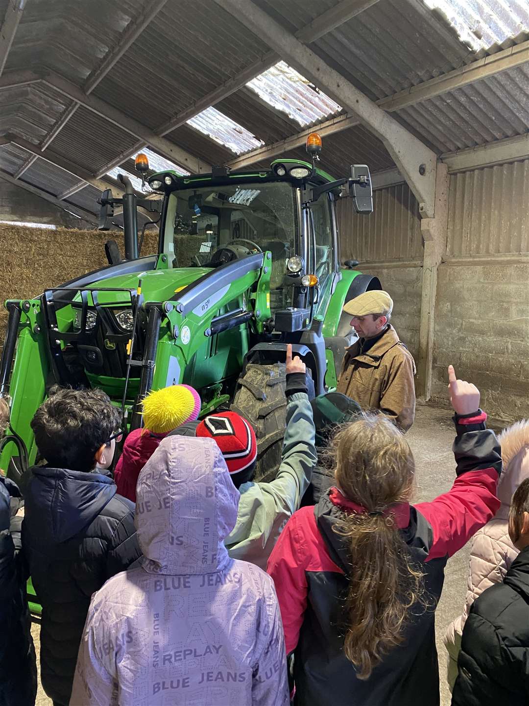 The kids were fascinated in the farm machinery