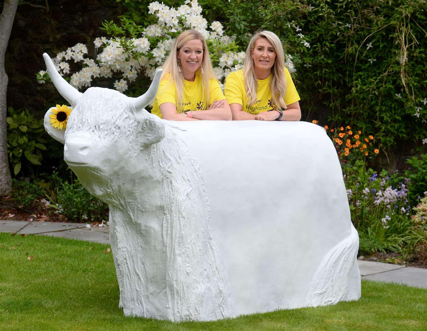 From left, Highland's Hospice's events fundraiser Jenna Hayden and corporate fundraiser Karen Duff with first Coo. The charity is looking for artists to decorate the Great Heilan Coo Art Trail sculptures. Picture: Gary Anthony