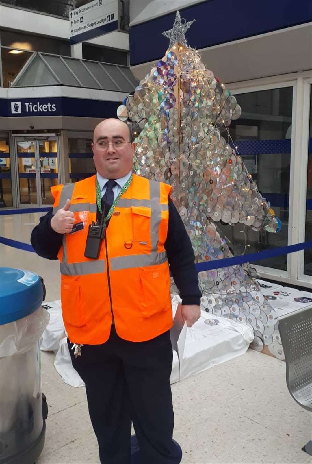 Scotrail employee Christopher with the new Christmas tree.